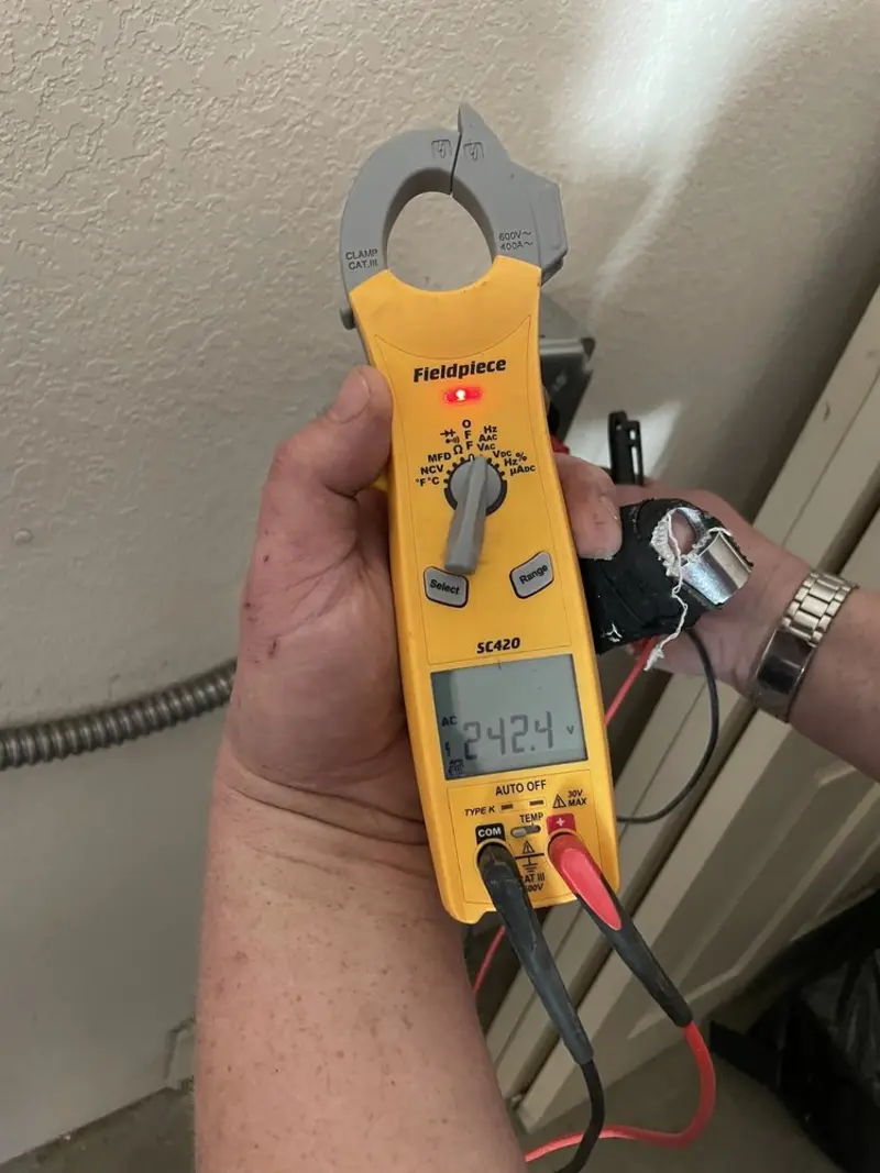 Voltage testing with clamp meter during Electrical Installation Services in Cypress Gardens